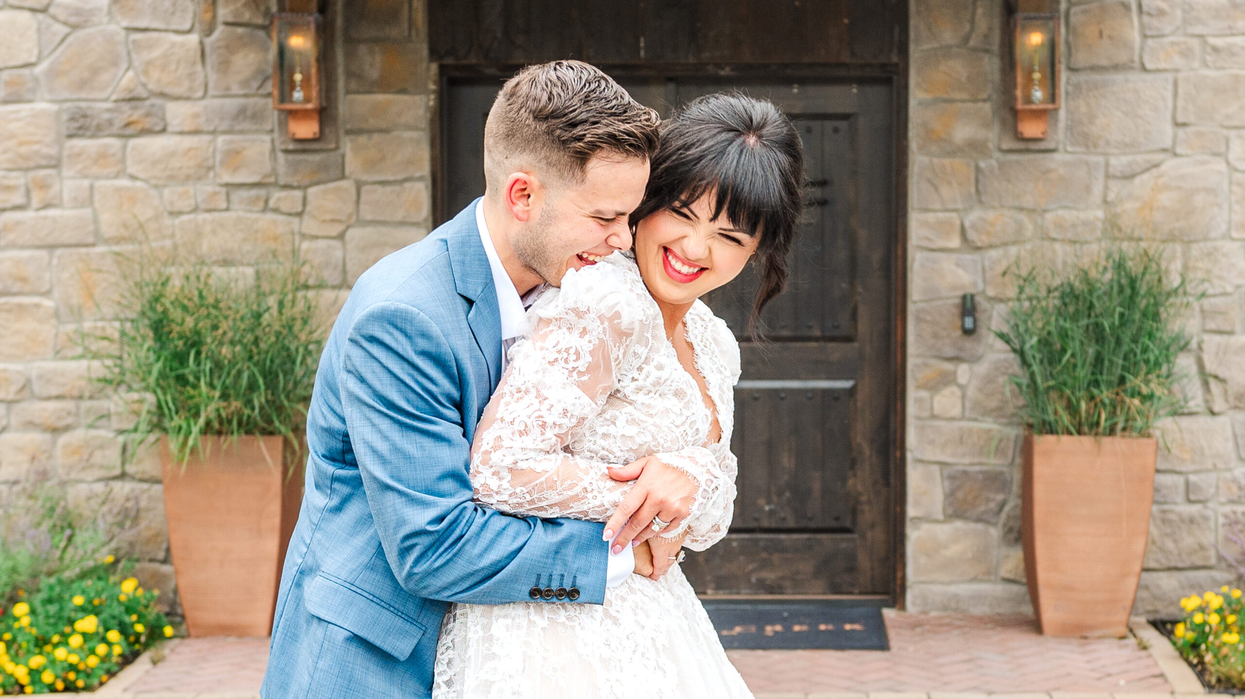 bride and groom hugging and laughing