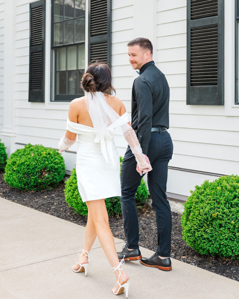bride and groom strolling to lexington wedding reception