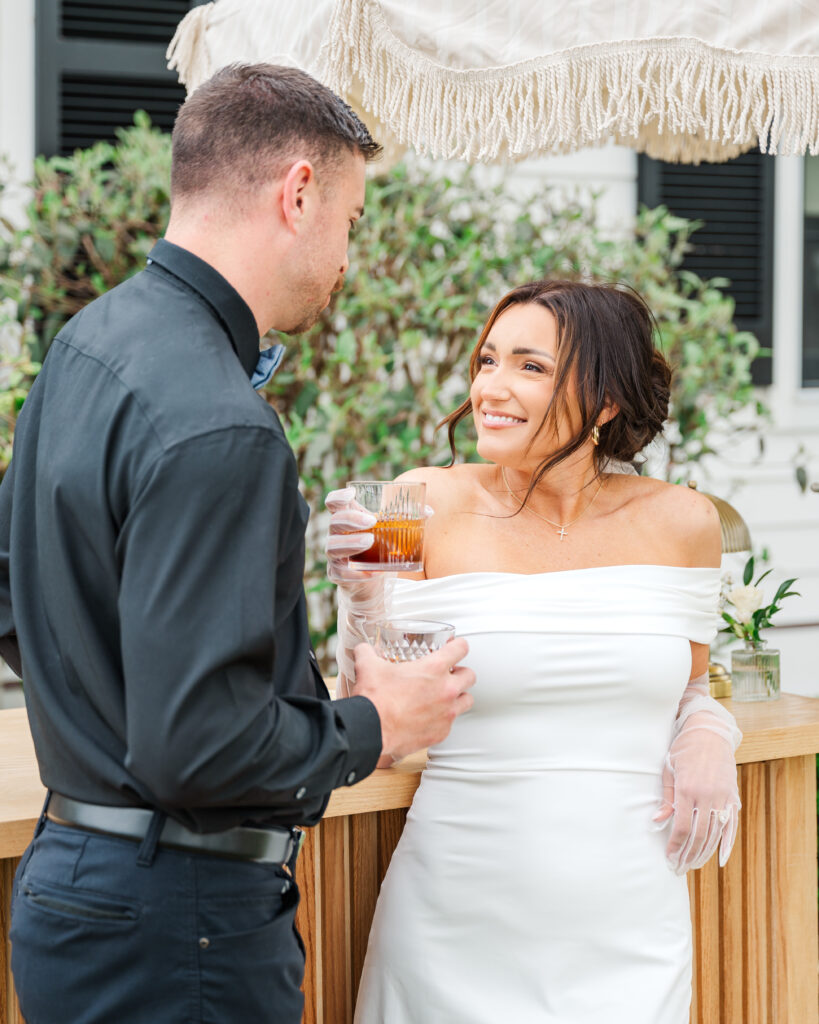 bride and groom enjoying drinks at the bar in lexington wedding