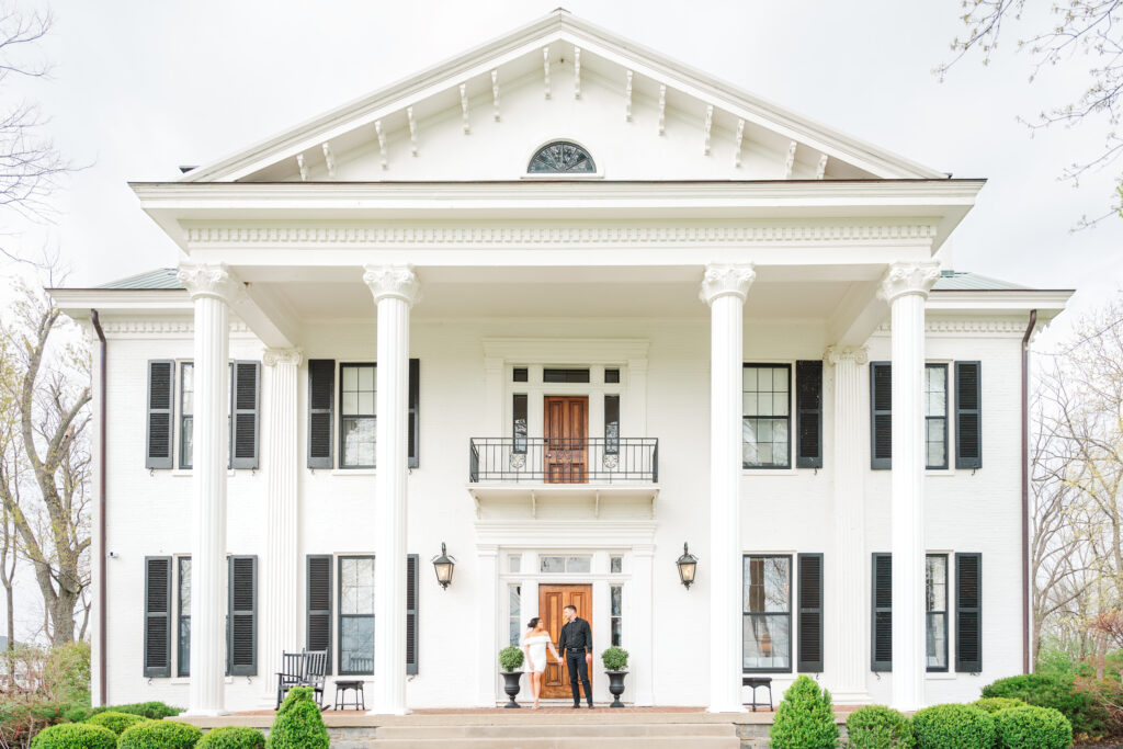 bride and groom in front of stunning ashford acres inn