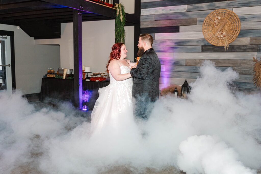 bride and groom dancing in the clouds at lexington wedding