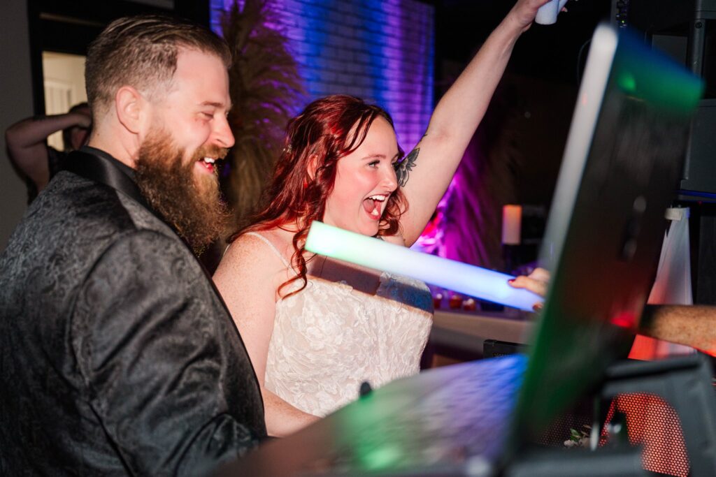 bride and groom at lexington wedding dj booth